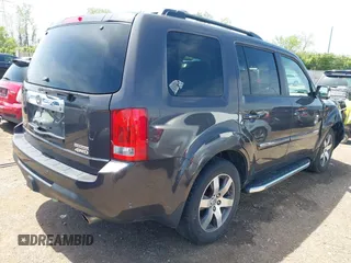 2012 Honda Pilot Touring with VIN 5FNYF4H9XCB083406, listed as a IAAI auction lot 42107651 with 217,678 mi miles. Bid and sale history available at carsss.com. Image 4.