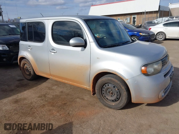 2013 Nissan Cube SL z VIN JN8AZ2KR3DT303767, wystawiony jako IAAI lot #41415942 z przebiegiem 148 218 mil mil oraz . Historia ofert i sprzedaży dostępna na DreamBid. Obrazek 1.