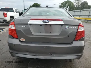 2012 Ford Fusion Hybrid z VIN 3FADP0L33CR211609, wystawiony jako Copart lot #60873005 z przebiegiem 144 474 mil mil oraz Szkoda całkowita • Salvage title. Historia ofert i sprzedaży dostępna na DreamBid. Obrazek 6.