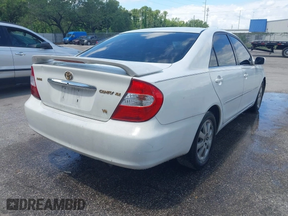 2002 Toyota Camry XLE z VIN 4T1BF32K42U035090, wystawiony jako IAAI lot #42250135 z przebiegiem 176 364 mil mil oraz . Historia ofert i sprzedaży dostępna na DreamBid. Obrazek 4.