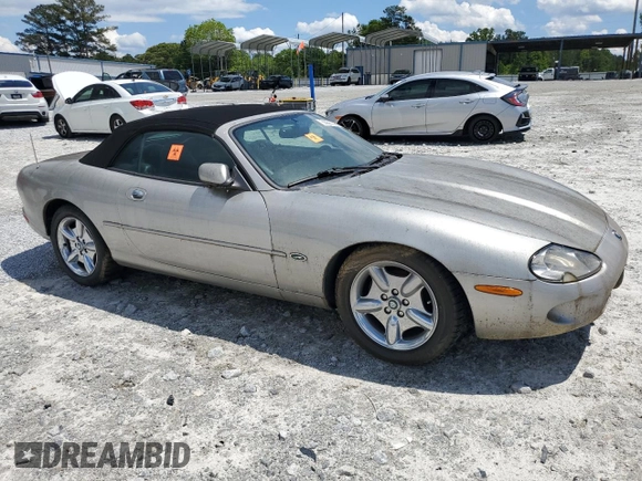 1999 Jaguar XK z VIN SAJGX2049XC034022, wystawiony jako Copart lot #55690025 z przebiegiem Nie podano mil oraz Tytuł czysty. Historia ofert i sprzedaży dostępna na DreamBid. Obrazek 4.