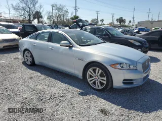2014 Jaguar XJ with VIN SAJWA1CZ4E8V71167, listed as a Copart auction lot 43994545 with 69,682 mi miles and Salvage Title. Bid and sale history available at DreamBid. Image 4.