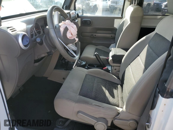 2010 Jeep Wrangler Sahara с VIN 1J4AA5D10AL181225, выставлен на аукционе Copart как лот 79696464 с пробегом 90 139 миль миль и Списание • Salvage title. История ставок и продаж доступна на DreamBid. Изображение 7.