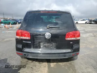 2005 Volkswagen Touareg z VIN WVGZG77LX5D063808, wystawiony jako Copart lot #44457935 z przebiegiem 172 252 mil mil oraz Czysty tytuł • Clean title. Historia ofert i sprzedaży dostępna na DreamBid. Obrazek 6.