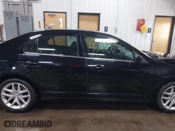 2012 Ford Fusion SEL z VIN 3FAHP0JA8CR125067, wystawiony jako IAAI lot #42000958 z przebiegiem 101 140 mil mil oraz . Historia ofert i sprzedaży dostępna na DreamBid. Obrazek 14.
