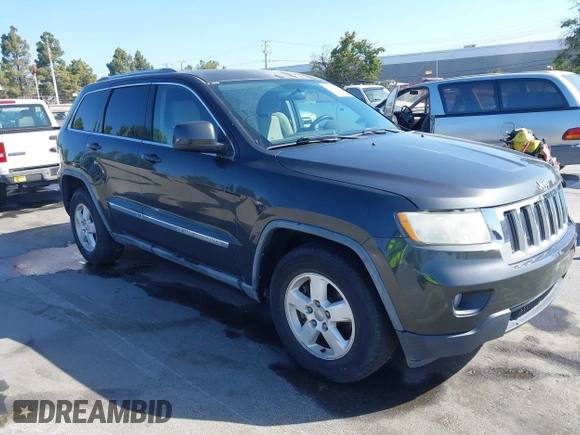 2011 Jeep Grand Cherokee Laredo z VIN 1J4RR4GG6BC562133, wystawiony jako IAAI lot #42330831 z przebiegiem 168 657 mil mil oraz . Historia ofert i sprzedaży dostępna na DreamBid. Obrazek 1.