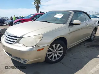 2010 Chrysler Sebring Touring with VIN 1C3BC5ED7AN142671, listed as a IAAI auction lot 42021533 with 115,098 mi miles and . Bid and sale history available at DreamBid. Image 2.
