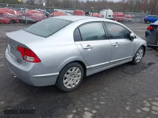 2009 Honda Civic Sdn LX with VIN 2HGFA16559H313538, listed as a IAAI auction lot 42052791 with 136,594 mi miles. Bid and sale history available at carsss.com. Image 4.