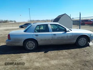 2006 Mercury Grand Marquis LS Premium z VIN 2MEHM75W56X605511, wystawiony jako IAAI lot #41642522 z przebiegiem 120 054 mil mil oraz . Historia ofert i sprzedaży dostępna na DreamBid. Obrazek 13.