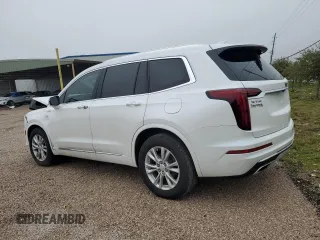 2021 Cadillac XT6 Luxury z VIN 1GYKPAR46MZ132157, wystawiony jako Copart lot #83911054 z przebiegiem 59 473 mil mil oraz Czysty tytuł • Clean title. Historia ofert i sprzedaży dostępna na DreamBid. Obrazek 2.