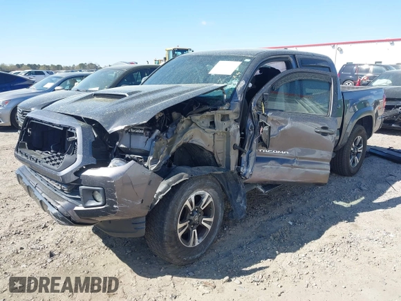 2017 Toyota Tacoma SR5 with VIN 5TFAZ5CN7HX033594, listed as a IAAI auction lot 41881117 with 86,676 mi miles and . Bid and sale history available at DreamBid. Image 2.