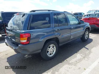 2004 Jeep Grand Cherokee Laredo with VIN 1J4GX48S44C205469, listed as a IAAI auction lot 42310571 with 154,929 mi miles and . Bid and sale history available at DreamBid. Image 4.