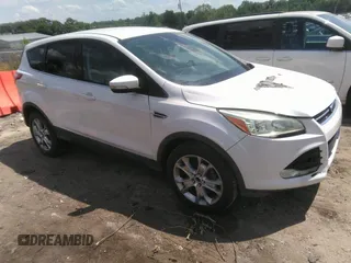 2013 Ford Escape SEL with VIN 1FMCU0HX1DUB63673, listed as a IAAI auction lot 42232003 with 116,230 mi miles and . Bid and sale history available at DreamBid. Image 1.