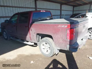 2016 Chevrolet Silverado 1500 LT with VIN 3GCUKREC9GG323309, listed as a IAAI auction lot 41653595 with 130,775 mi miles. Bid and sale history available at carsss.com. Image 3.