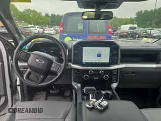 2023 Ford F-150 Lightning Pro z VIN 1FTVW1EL0PWG02840, wystawiony jako IAAI lot #42379448 z przebiegiem 52 710 mil mil oraz . Historia ofert i sprzedaży dostępna na DreamBid. Obrazek 19.