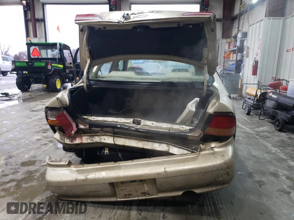 1998 Nissan Maxima GXE with VIN JN1CA21D3WT532196, listed as a Copart auction lot 43210915 with 277,946 mi miles and Salvage title. Bid and sale history available at DreamBid. Image 6.