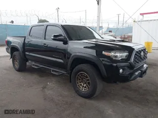 2023 Toyota Tacoma 4WD SR with VIN 3TMCZ5AN5PM533379, listed as a IAAI auction lot 42052154 with 31,776 mi miles. Bid and sale history available at carsss.com. Image 1.