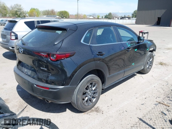2021 Mazda CX-30 S with VIN 3MVDMBAL6MM302498, listed as a IAAI auction lot 42012356 with 50,477 mi miles and . Bid and sale history available at DreamBid. Image 4.