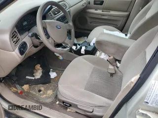 2005 Ford Taurus SE with VIN 1FAFP53U75A125148, listed as a Copart auction lot 49606165 with 216,300 mi miles and Salvage title. Bid and sale history available at DreamBid. Image 7.