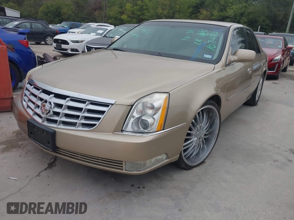 2006 Cadillac DTS 1SC z VIN 1G6KD57Y56U102470, wystawiony jako IAAI lot #40758530 z przebiegiem 149 330 mil mil oraz . Historia ofert i sprzedaży dostępna na DreamBid. Obrazek 2.