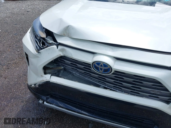 2021 Toyota RAV4 Hybrid XSE with VIN 4T3E6RFV9MU052563, listed as a IAAI auction lot 42295510 with 24,771 mi miles and . Bid and sale history available at DreamBid. Image 6.