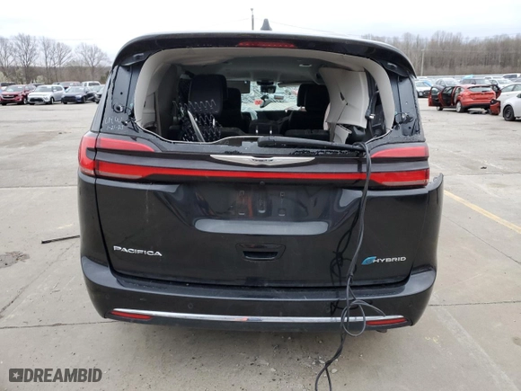 2023 Chrysler Pacifica Hybrid Touring L with VIN 2C4RC1L74PR554462, listed as a Copart auction lot 49627445 with 0 mi miles and Non Repairable. Bid and sale history available at carsss.com. Image 6.