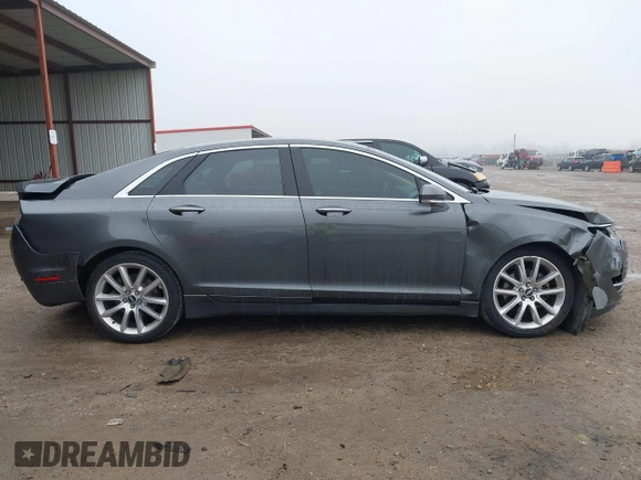 2015 Lincoln MKZ z VIN 3LN6L2G99FR604894, wystawiony jako IAAI lot #41433264 z przebiegiem 262 472 mil mil oraz . Historia ofert i sprzedaży dostępna na DreamBid. Obrazek 14.