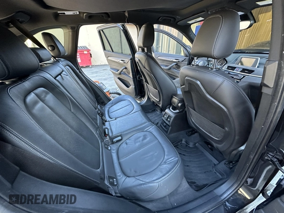 2017 BMW X1 xDrive28i with VIN WBXHT3C32H5F67896, listed as a IAAI auction lot 41823288 with 80,130 mi miles. Bid and sale history available at carsss.com. Image 7.