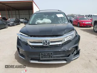 2020 Honda Pilot Touring 8-Passenger with VIN 5FNYF6H91LB003552, listed as a IAAI auction lot 41743685 with 76,725 mi miles and . Bid and sale history available at DreamBid. Image 12.