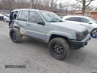 1995 Jeep Grand Cherokee Laredo with VIN 1J4GZ58S4SC778322, listed as a IAAI auction lot 41498800 with 255,058 mi miles. Bid and sale history available at carsss.com. Image 1.