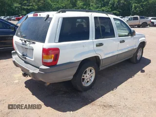 2002 Jeep Grand Cherokee Laredo with VIN 1J4GX48S32C134911, listed as a IAAI auction lot 42323138 with 156,852 mi miles and . Bid and sale history available at DreamBid. Image 4.
