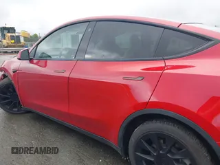 2021 Tesla Model Y Long Range with VIN 5YJYGDEE5MF085032, listed as a IAAI auction lot 41982925 with 64,541 mi miles and . Bid and sale history available at carsss.com. Image 14.