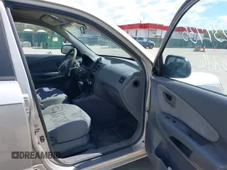 2005 Hyundai Tucson GL with VIN KM8JM12B75U075660, listed as a IAAI auction lot 42037735 with 157,453 mi miles. Bid and sale history available at carsss.com. Image 5.