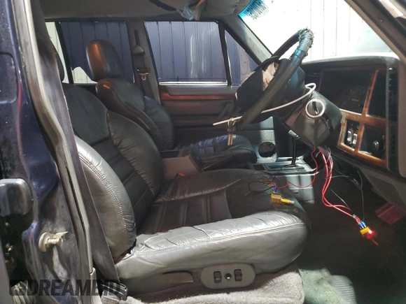 1995 Jeep Cherokee z VIN 1J4FN78S7SL537213, wystawiony jako Copart lot #58700105 z przebiegiem 261 606 mil mil oraz Szkoda całkowita • Salvage title. Historia ofert i sprzedaży dostępna na DreamBid. Obrazek 7.