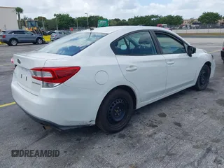 2018 Subaru Impreza with VIN 4S3GKAA68J3609404, listed as a IAAI auction lot 41954733 with 214,560 mi miles. Bid and sale history available at carsss.com. Image 4.