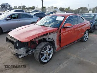 2015 BMW 2 Series 228i with VIN WBA1F9C56FVW98461, listed as a IAAI auction lot 41663193 with 94,584 mi miles. Bid and sale history available at carsss.com. Image 2.
