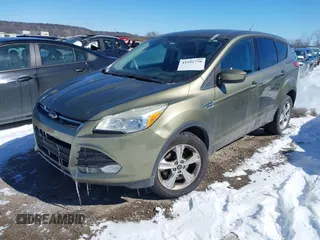 2013 Ford Escape SE with VIN 1FMCU0GX4DUC60741, listed as a IAAI auction lot 41592770 with 121,972 mi miles and . Bid and sale history available at DreamBid. Image 2.
