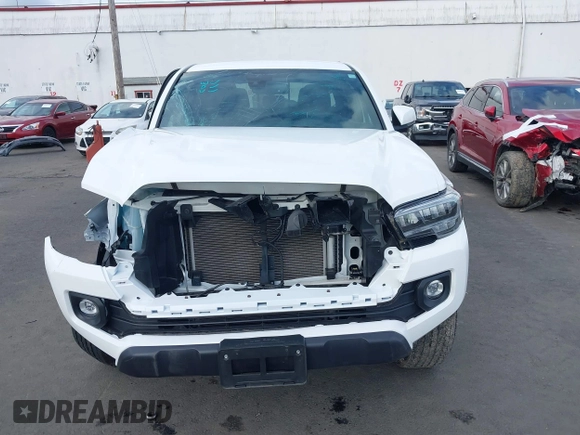 2023 Toyota Tacoma SR z VIN 3TMCZ5AN0PM541700, wystawiony jako IAAI lot #41819408 z przebiegiem 14 216 mil mil oraz . Historia ofert i sprzedaży dostępna na DreamBid. Obrazek 13.