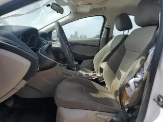 2013 Ford Focus SE z VIN 1FADP3F2XDL198801, wystawiony jako Copart lot #51985455 z przebiegiem 115 747 mil mil oraz Szkoda całkowita • Salvage title. Historia ofert i sprzedaży dostępna na DreamBid. Obrazek 7.