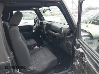 2011 Jeep Wrangler Sport with VIN 1J4AA2D18BL588273, listed as a IAAI auction lot 41857858 with 136,473 mi miles and . Bid and sale history available at carsss.com. Image 5.