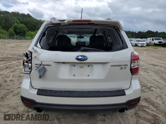 2015 Subaru Forester XT Touring with VIN JF2SJGUCXFH820469, listed as a Copart auction lot 62777665 with 90,389 mi miles and Salvage title. Bid and sale history available at DreamBid. Image 6.