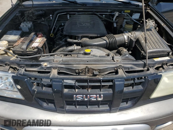 2003 Isuzu Rodeo z VIN 4S2CK58W734311374, wystawiony jako Copart lot #57949325 z przebiegiem 247 580 mil mil oraz Tytuł czysty. Historia ofert i sprzedaży dostępna na DreamBid. Obrazek 11.