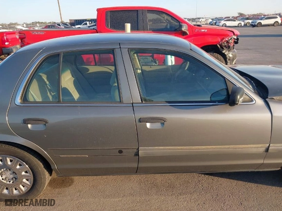 2004 Ford Crown Victoria Standard with VIN 2FAFP73W64X107579, listed as a IAAI auction lot 41823273 with 131,921 mi miles. Bid and sale history available at carsss.com. Image 14.