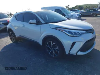 2021 Toyota C-HR LE with VIN NMTKHMBX0MR123981, listed as a IAAI auction lot 41273382 with 51,988 mi miles. Bid and sale history available at carsss.com. Image 1.