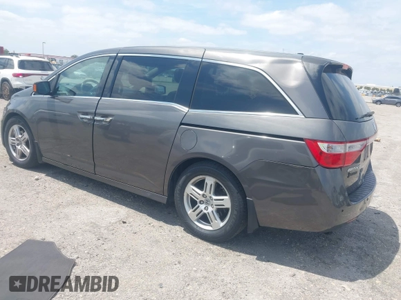 2012 Honda Odyssey Touring with VIN 5FNRL5H90CB088536, listed as a IAAI auction lot 42102008 with 283,350 mi miles and . Bid and sale history available at DreamBid. Image 3.