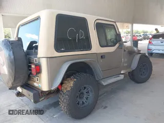 2003 Jeep Wrangler Sahara z VIN 1J4FA59S63P336928, wystawiony jako IAAI lot #42254314 z przebiegiem Nie podano mil oraz . Historia ofert i sprzedaży dostępna na DreamBid. Obrazek 4.