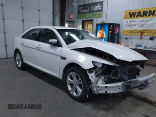 2013 Ford Taurus SEL z VIN 1FAHP2E81DG142899, wystawiony jako IAAI lot #42104046 z przebiegiem 207 292 mil mil oraz . Historia ofert i sprzedaży dostępna na DreamBid. Obrazek 1.