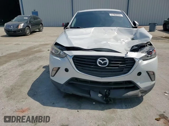 2017 Mazda CX-3 Touring z VIN JM1DKDC75H0168823, wystawiony jako Copart lot #57968955 z przebiegiem 116 231 mil mil oraz Szkoda całkowita • Salvage title. Historia ofert i sprzedaży dostępna na DreamBid. Obrazek 14.