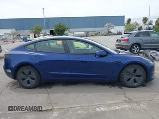 2021 Tesla Model 3 Long Range with VIN 5YJ3E1EB6MF878411, listed as a IAAI auction lot 41986947 with 71,978 mi miles and . Bid and sale history available at DreamBid. Image 14.