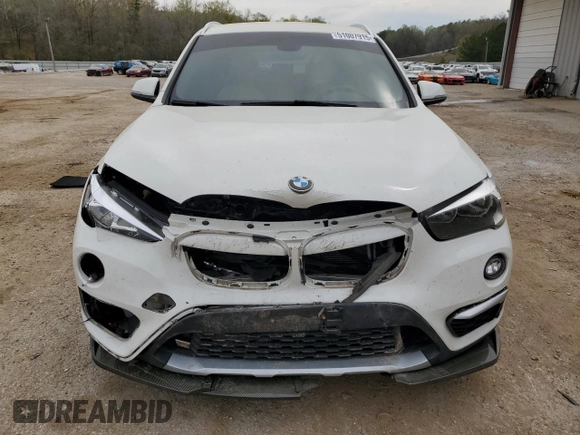 2017 BMW X1 sDrive28i with VIN WBXHU7C30H5H38049, listed as a Copart auction lot 51007915 with 52,963 mi miles and Salvage Title. Bid and sale history available at carsss.com. Image 5.